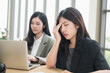 © PhugunStock - Asian businesswomen sit in a tense meeting and brainstorm, discussing analysis, innovation, collaboration. online business Modern sales techniques and strategic planning