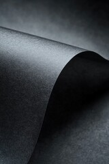 A close-up shot of a sheet of black paper with no visible marks or imperfections