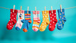 © Lightning - Colorful socks hanging on a clothesline against a vibrant blue background - playful and whimsical