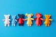 © Outkast - Paper dolls holding hands on blue background for use in projects related to unity