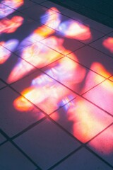 Wall Mural - Light reflections on the floor, creating abstract and colorful patterns on the tiles