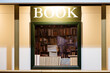 © Austockphoto - Stack of books inside window of Book Shop