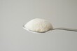 © Murda - Powdered substance resting in a silver spoon.