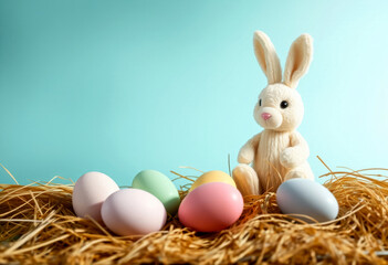 colorful easter eggs in pastel colors and plush easter bunny on blue background, easter concept