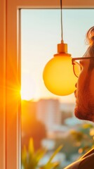 Aufkleber - Sunset Workspace Inspiration Millennial Male with Modern Glasses and Glowing Bulb - Enhancing Creativity in Urban Offices and Sustainable Lighting Solutions