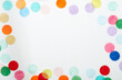 © Tetra Images - Colorful confetti frame on white background