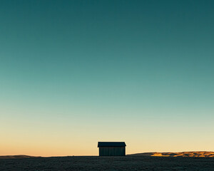 Poster - A small wooden cabin stands isolated on a vast, empty landscape with a clear gradient sky, symbolizing solitude, isolation, minimalism, and peaceful tranquility in nature.
