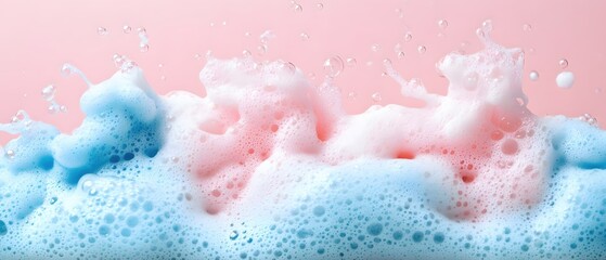 Poster - Gentle bubbles of pink and blue soap foam on a soft pink background creating a dreamy scene