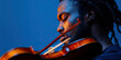 © Lila Patel - Close-up of a Man Playing a Violin