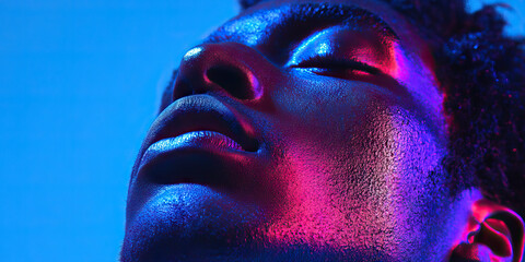 Poster - Close-up Portrait: Face Illuminated by Blue and Pink Light