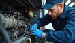© miss irine - Mechanic repairs truck engine in service station. Man in blue uniform, gloves under bonnet fixes motor. Automotive technician works, maintenance, repair, labor, skill, safety, expertise, diligence,