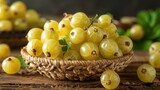 A basket of fresh yellow gooseberries on a wooden surface, highlighting their natural appeal.