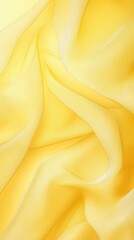 Poster - flowing yellow fabric draping with soft, undulating folds, creating serene texture and elegant curve
