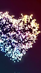 Poster - Vibrant heart shape transitions with glowing particles in motion