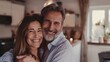 © Z A C - 'A smiling couple embracing each other in a cozy kitchen setting.'