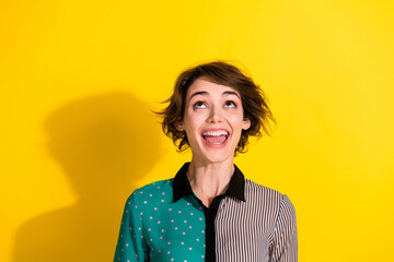 Aufkleber - Photo of positive lovely glad girl wear trendy print clothes look up empty space isolated on yellow color background