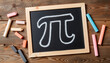 © Sun Flower - Chalk drawing of Pi symbol on rustic table, celebrating Pi Day