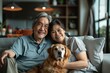 © Markus Schröder - Portrait of a satisfied asian couple in their 40s relaxing with their dog on the sofa