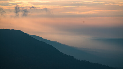 Wall Mural - experience peaceful beauty of mountain landscape: scenic view of sunset and sunrise at the peak, sil