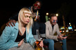 © liderina - Group of Multi-Ethnicity people having fun outdoor in the night. Celebrate.