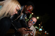 © liderina - Group of Multi-Ethnicity people having fun outdoor in the night. Celebrate.