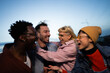© liderina - Group of Multi-Ethnicity people having fun outdoor in the night. Celebrate.