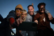 © liderina - Group of Multi-Ethnicity people having fun outdoor in the night. Celebrate.