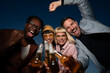 © liderina - Portrait of cheerful people outdoor with beer. Looking at camera.
