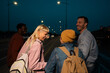 © liderina - Group of Multi-Ethnicity people having fun outdoor in the night. Celebrate.