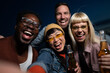 © liderina - Group of Multi-Ethnicity people having fun outdoor in the night. Celebrate.