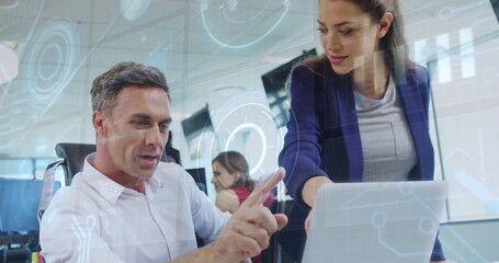 Poster - Analyzing data on laptop, business people with holographic charts image over office