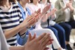 © New Africa - People applauding during meeting indoors, closeup view