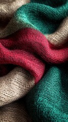 Poster - Close up of elegant soft wool scarf with red green and beige colors creating a cozy and warm atmosphere perfect for winter fashion and style