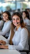 © Oksana - Focused customer service representatives assist clients in a modern call center during a busy workday