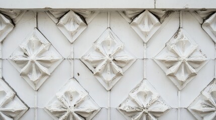 Fototapete - Intricate white decorative wall panel featuring diamond shapes and textured patterns in a beautifully crafted design ideal for architectural photography and interior decor projects