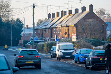 Naklejka na meble Frost snow covered british road and cars in england uk