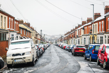 Naklejka na meble Frost snow covered british road and cars in england uk