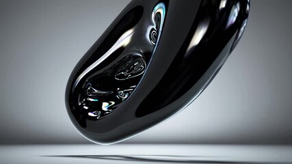Poster - Floating above a smooth gray surface, an abstract black blob showcases iridescent reflections, creating a striking visual contrast against the minimalist background