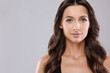 © New Africa - Hair styling. Portrait of beautiful woman with wavy long hair on grey background, space for text