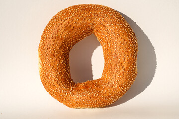 Wall Mural - bagels with sesame seeds on white background