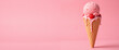 © Yury - Delicious pink ice cream cone topped with raspberries oozing with melted cream against a vibrant pink background