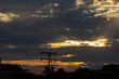 © ric - silhouette of electric pole and power line with beautiful sunset background