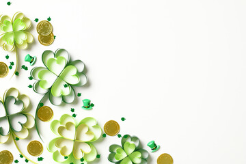 Wall Mural - St. Patrick's Day concept with green shamrocks, gold coins, and leprechaun hats on a white background.