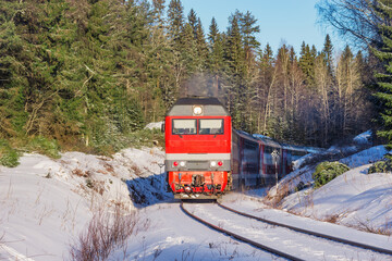 Wall Mural - Passenger train moves at winter morning.