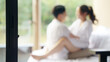 © ChayTee - Blurred asia people young adult body on hotel cozy sofa bed outdoor home in health care safe sex flirt relax hug kiss. I love you man woman falling in love tender sexual pose happy asian just married.