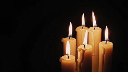 Wall Mural - Candles on black background