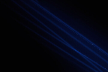 Wall Mural - abstract black background with diagonal blue lines made of dots