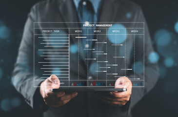 Aufkleber - Efficient Project Management. Engineer or site manager utilizes tablet for construction planning with Gantt charts. Track engineering progress, update tasks, and generate reports seamles