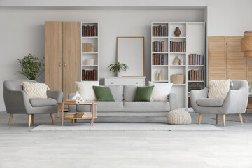 Wall Mural - Interior of modern living room with bookcases, sofa, armchair and coffee table