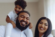 © Ira Yapanda - Modern muslim family. Happy mother and father with son, hugging together